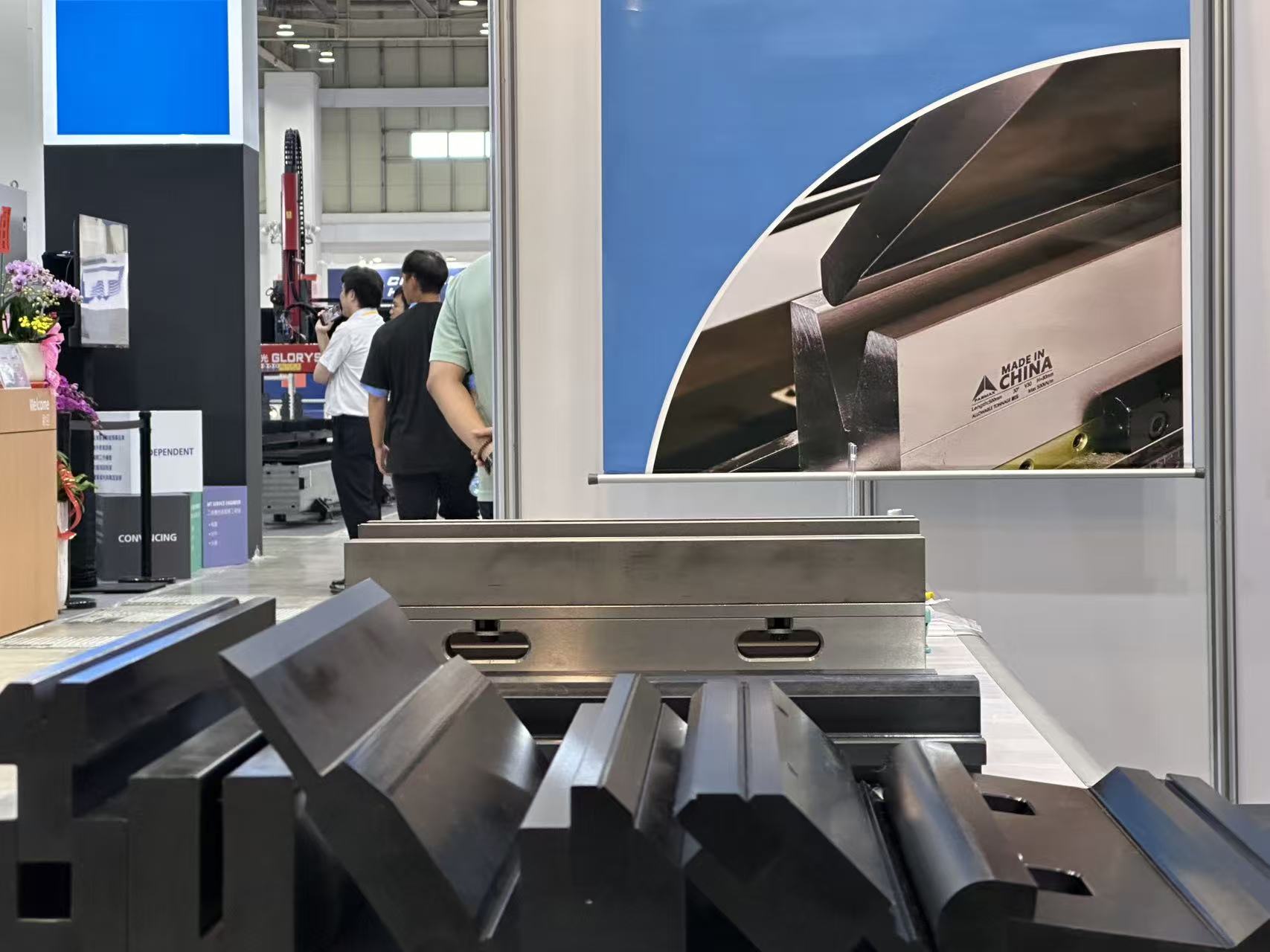 Fabmax press brake punches and dies on display at a machine tool trade show booth